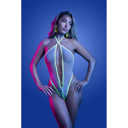 Model wearing a neon green and red swimsuit against a blue background